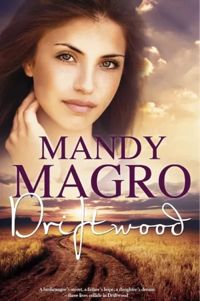 Cover of "Driftwood" by Mandy Magro featuring a woman's portrait against a dramatic sky. Text includes a tagline.