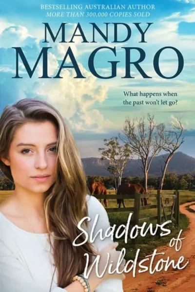 Mandy Magro's "Shadows of Wildstone"; tagline: "What happens when the past won't let go?" with a rural background.