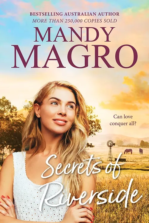 Mandy Magro's "Secrets of Riverside" book cover featuring a woman in a field with a windmill. Text: "Can love conquer