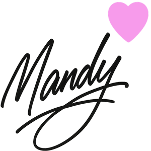 Signature of Mandy Magro with a pink heart above the name.